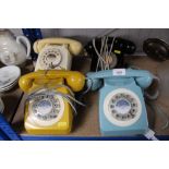 Four rotary telephones