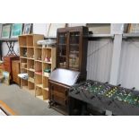 An oak and glazed bureau bookcase