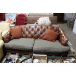 A button back upholstered three seater settee