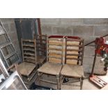 A set of four ladder back dining chairs