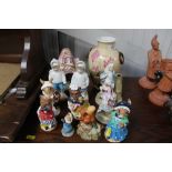 A quantity of various figurines, ornaments, vase e