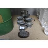 A quantity of pewter mugs and a small trinket box