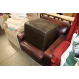 A Leathermaster armchair and associated footstool
