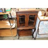 An Edwardian mahogany and glazed cabinet