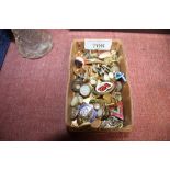 A box containing various cufflinks; badges etc