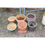 Two terracotta planters and four others