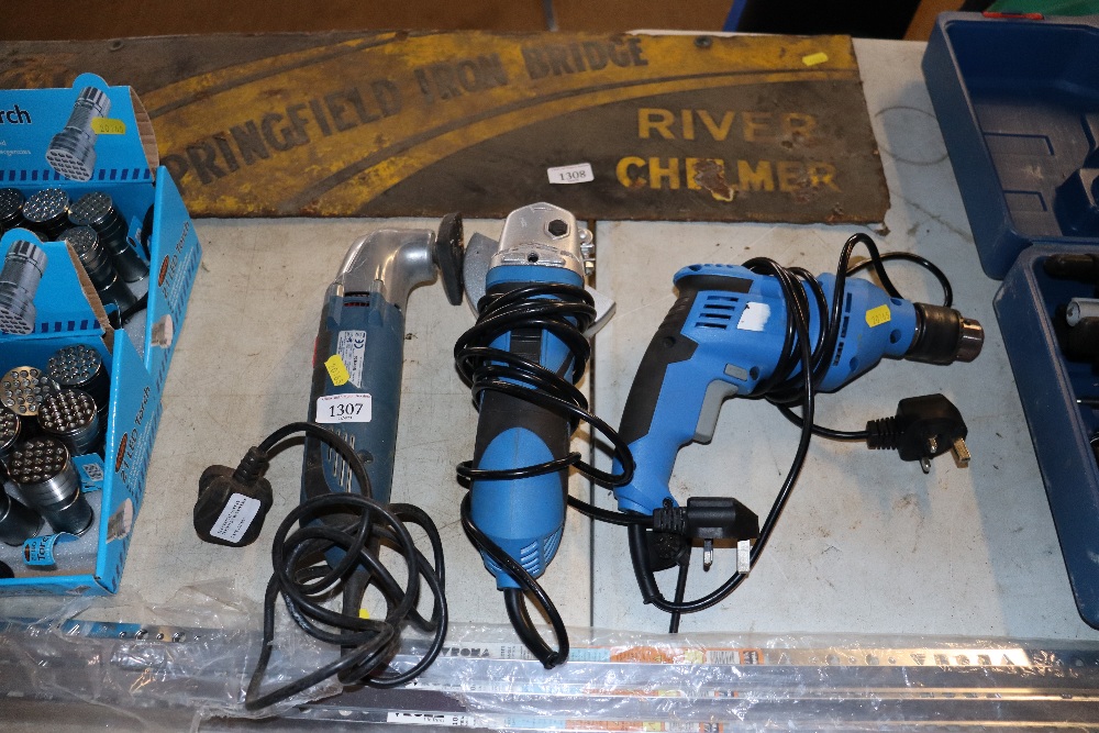 An electric drill together with an angle grinder a