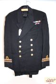 A WWII era Navy uniform jacket with medal ribbons