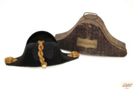 A Naval bicorn hat by Gieves Ltd AF with japanned