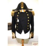 A Royal Navy dress coat complete with bicorn hat a