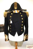 A Royal Navy dress coat complete with bicorn hat a