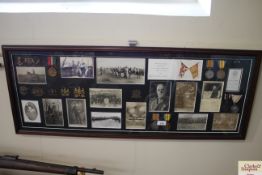 A WWI themed collage of medals, photographs and ba