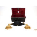 A Naval bicorn hat with a pair of epaulettes, all