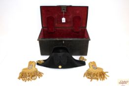 A Naval bicorn hat with a pair of epaulettes, all