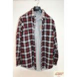 A checked shirt (size L) unworn with another