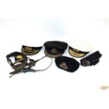 A quantity of Naval caps and belts