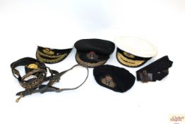 A quantity of Naval caps and belts