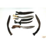 Three vintage Kukri with two other ethnic examples