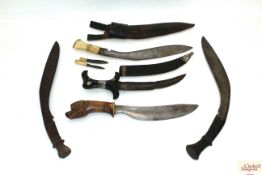 Three vintage Kukri with two other ethnic examples