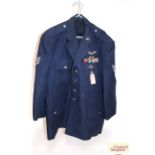 A post war U.S.A.F Jacket with badges, medal ribbo