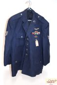 A post war U.S.A.F Jacket with badges, medal ribbo