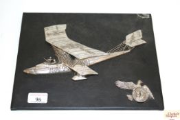 A metal "3D" plaque depicting a German WWI bi-plan