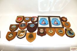 A box of fifteen military related plaques with two