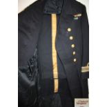 A WWI era Royal Navy frock coat and trousers. Tail