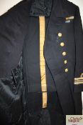 A WWI era Royal Navy frock coat and trousers. Tail