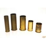 Five various brass shell cases including three WWI