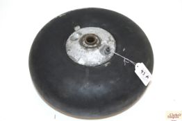 A WWII era wheel, tyre 4.95-3½ marked A.M. with cr