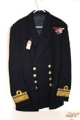 A Royal Navy jacket, label to J.W.D. Cook with Re