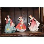 Two Royal Doulton figurines and a Coalport example