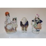 A Staffordshire style figure "Roger Giles" and two