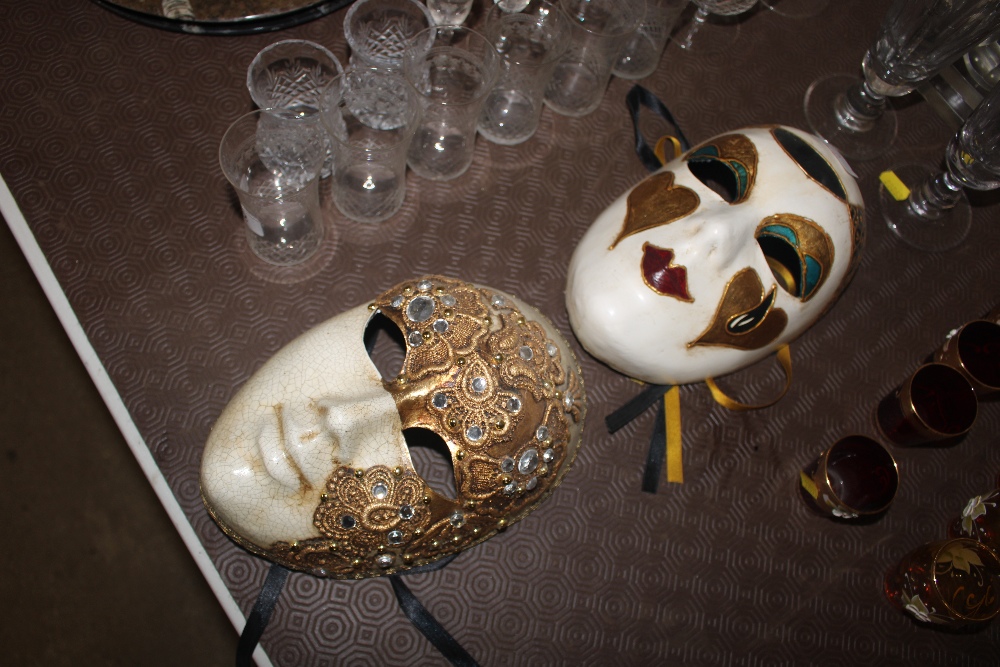 A pair of decorative ball masks