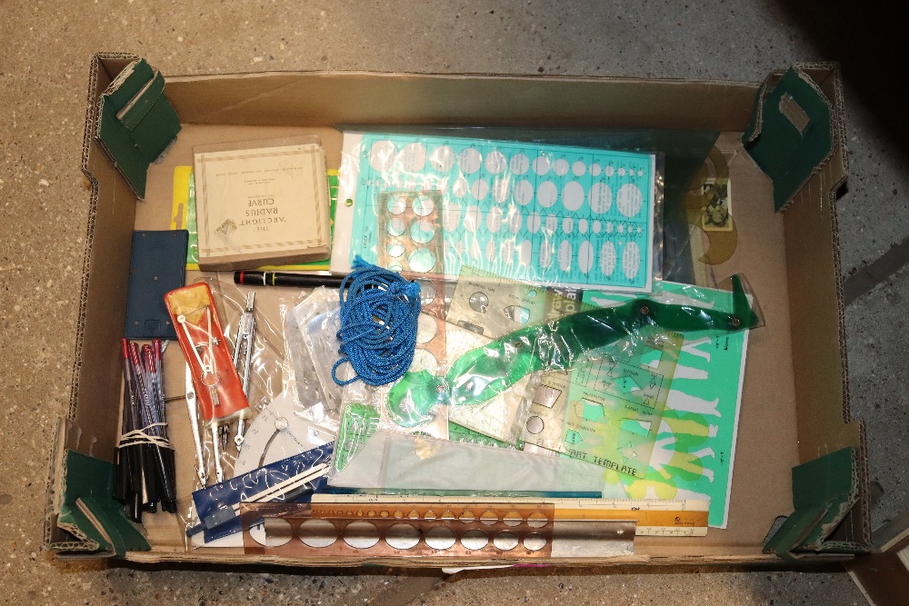 A box of various drawing instruments