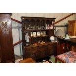 An antique carved oak dresser