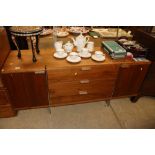 A teak and polished metal mounted sideboard