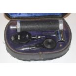 A vintage Gawlland Ophthalmoscope in case