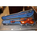 A violin and bow in fitted case