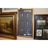 A framed collection of miniature medals