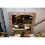 A limed wood framed wall mirror