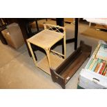 An oak book rack and a bamboo and wicker bedside ta