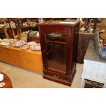 A mahogany glazed side cabinet fitted single drawe