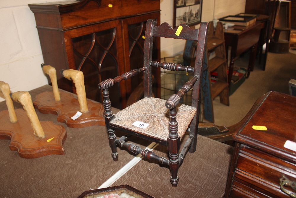 An antique Apprentice made child's chair with turn