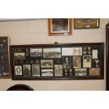 A WWI themed collage of medals, photographs, badge