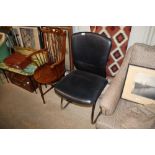 A retro type leatherette upholstered chair on tubu