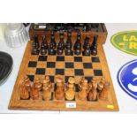 A wooden chess set and board