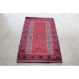 An approx. 4'7" x 2'9" New Baluchi rug