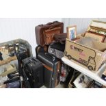 A collection of suitcases and bags